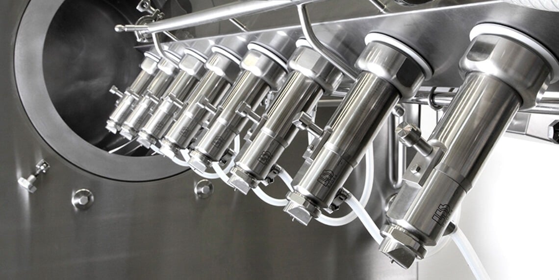 Tablet coating nozzle arm